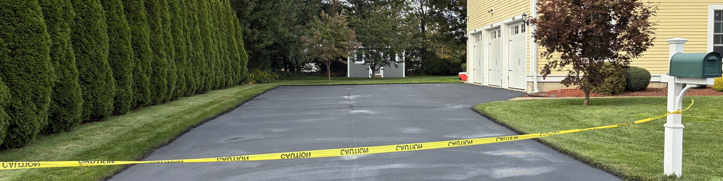 asphalt driveway at colonial home