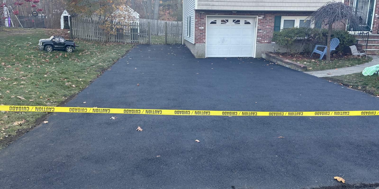 New asphalt driveway paving in autumn