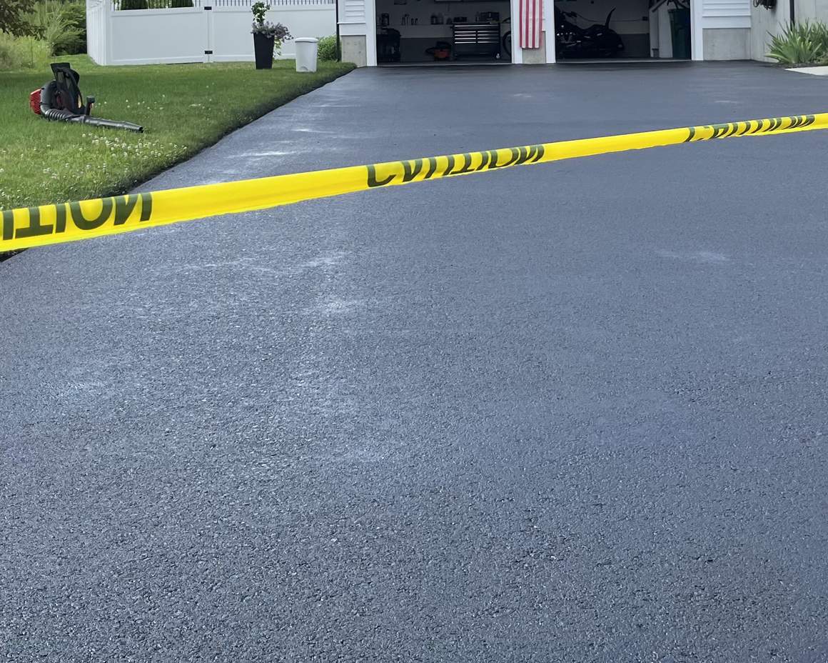 Fresh asphalt driveway at a Quincy home