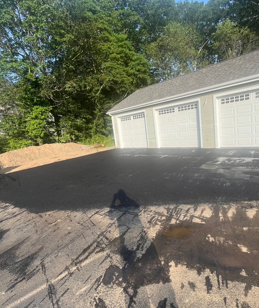 completed driveway with safety cones