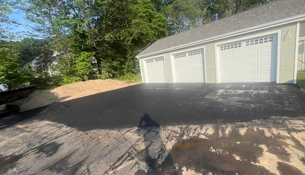 completed driveway with safety cones