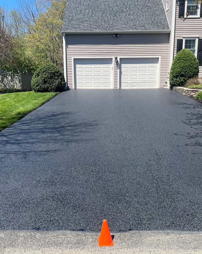 fresh asphalt at three-car garage